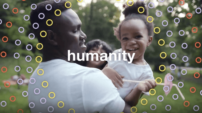 Together for ChangeTM video featuring a father and his child with the word 'humanity'.