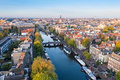 Regeneron location in Amsterdam, Netherlands. Amsterdam skyline with a canal.