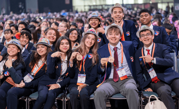  A large group of Regeneron International Science and Engineering Fair finalists smiling.