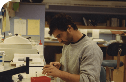  Co-Founder, Board co-Chair, President and CSO George Yancopoulos, MD, PhD, working in the lab in the 1980s.