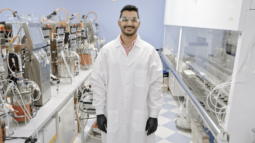 Video featuring a Regeneron scientist posing and smiling in a lab.